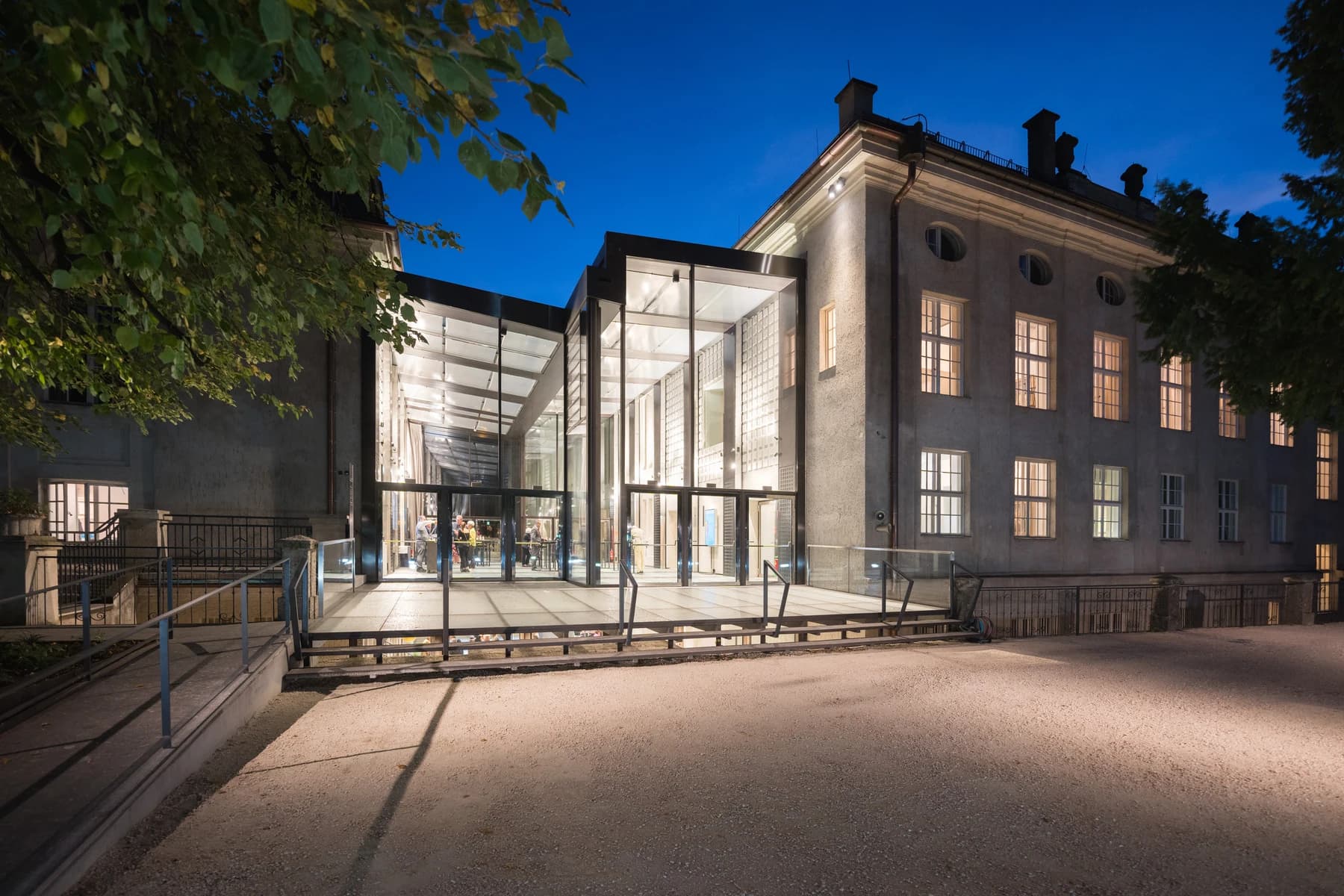 Stiftung Mozarteum · illuminated foyer at dusk